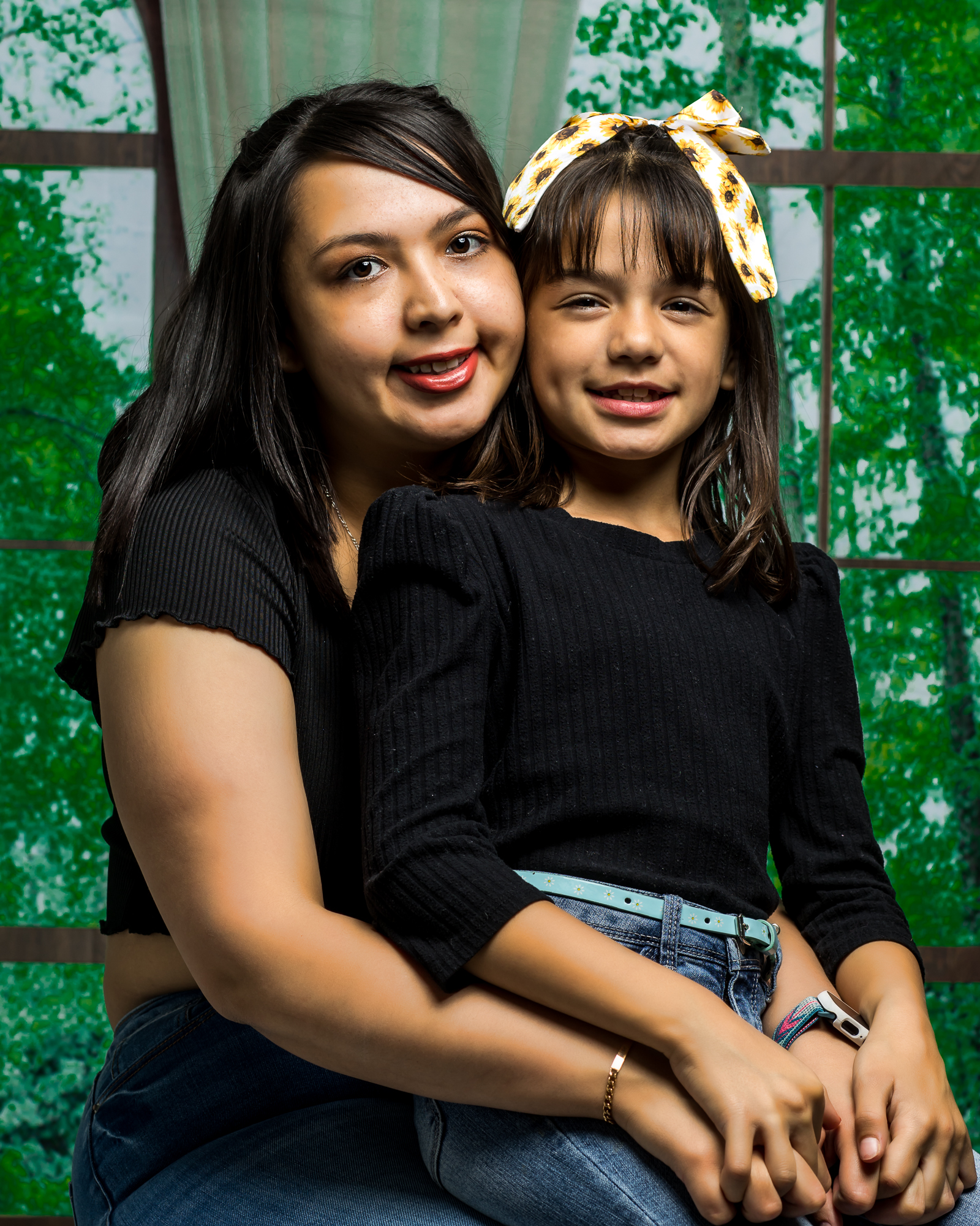 a woman with her child smiling at the camera